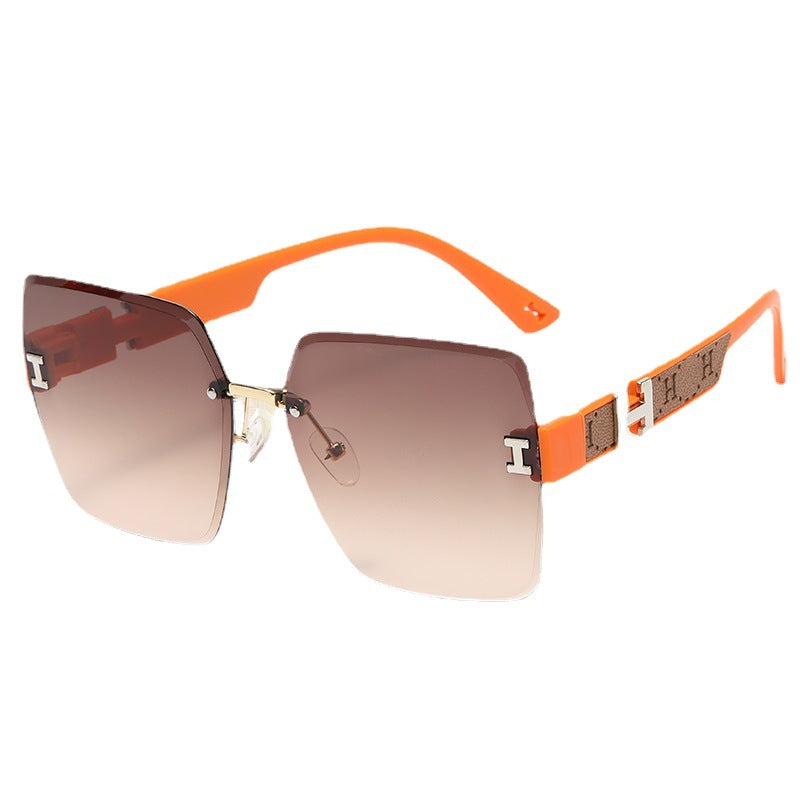 2023 new frameless two-color gradual change high-end women's trend driving sunglasses fashion sunglasses wholesale factory