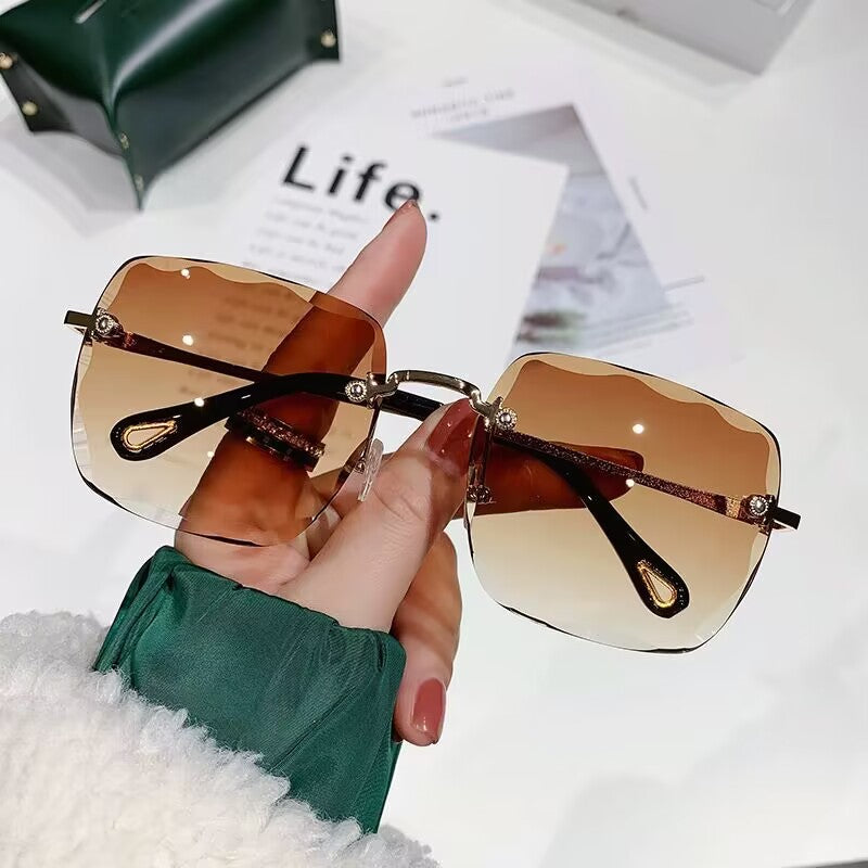 2023 new frameless trimmed sunglasses trendy women's sunscreen sunglasses show face small driving sunshade glasses