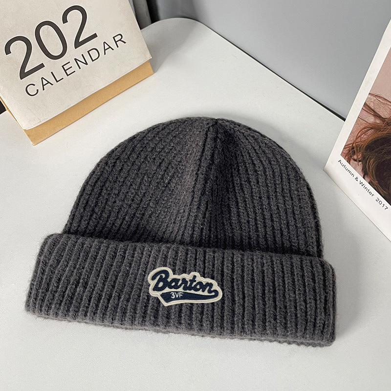 Winter letter labeling wool hat women's autumn and winter versatile warm Japanese knitted hat showing small face and ear protection cold hat man