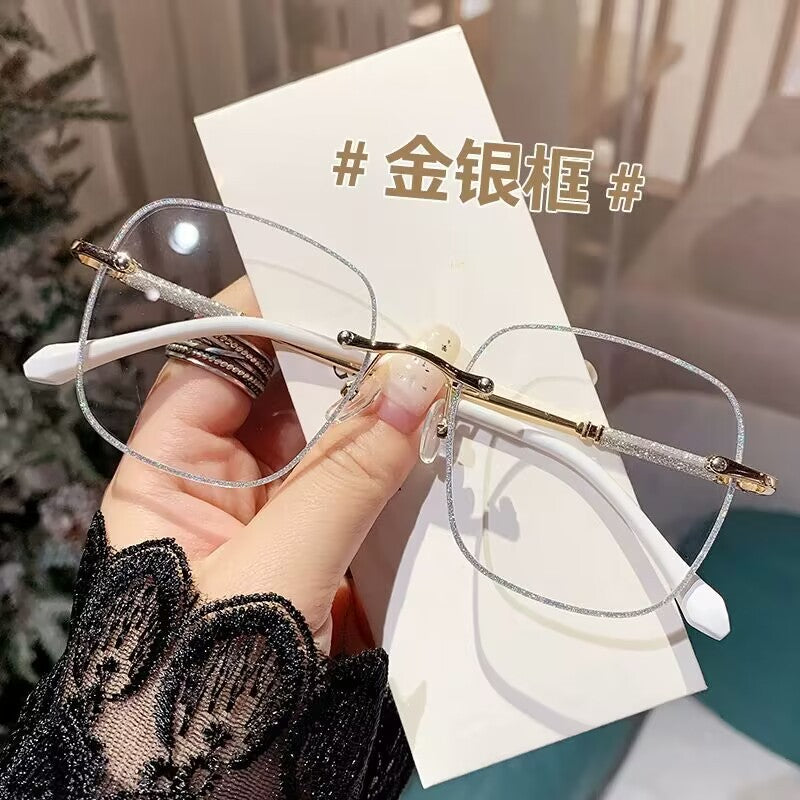 2023 fashion trendy frameless gold powder design high sense anti-blue glasses women's Internet celebrity flat glasses wholesale