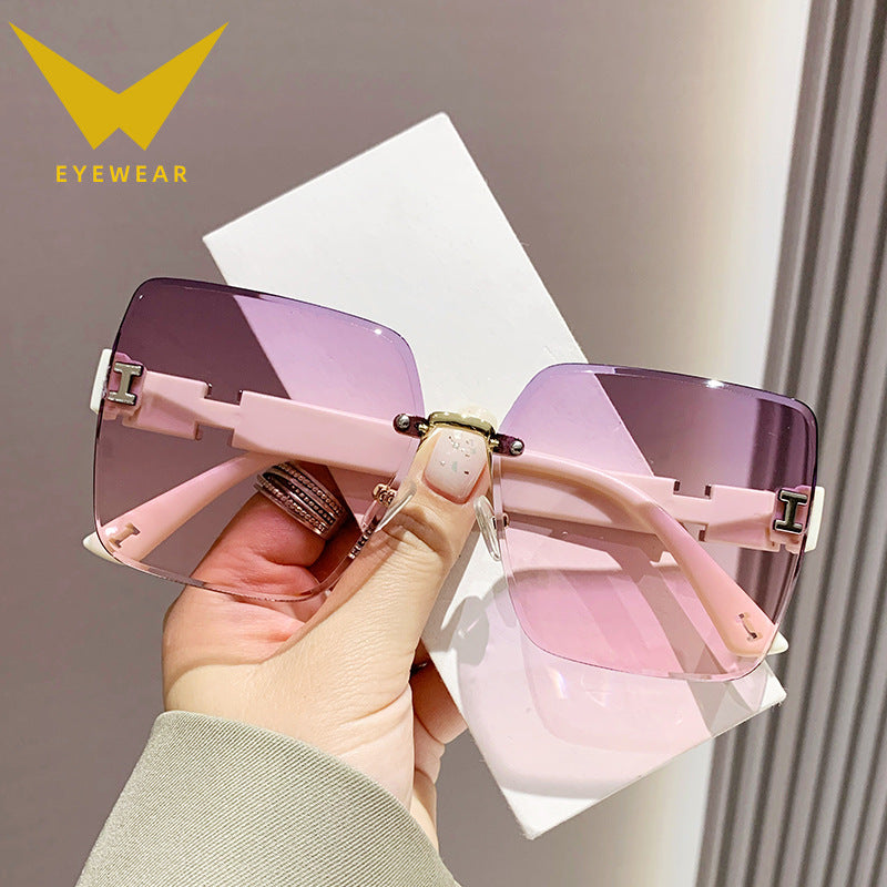 2023 new frameless two-color gradual change high-end women's trend driving sunglasses fashion sunglasses wholesale factory