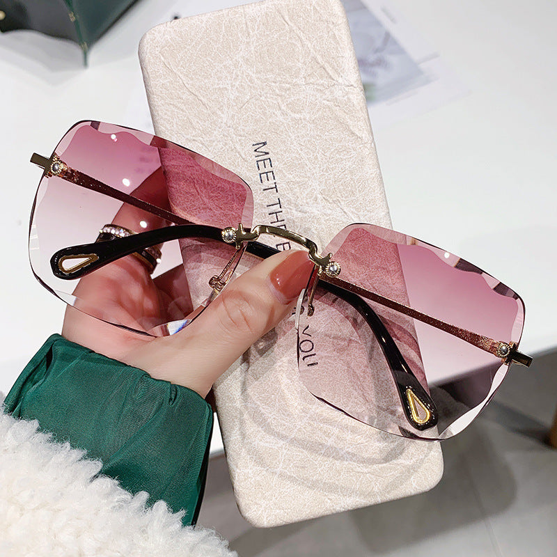 2023 new frameless trimmed sunglasses trendy women's sunscreen sunglasses show face small driving sunshade glasses