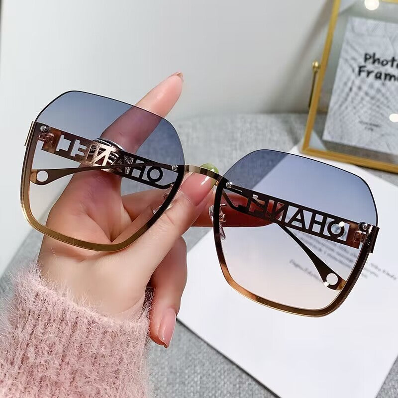 Women's fashion frameless trimmed sunglasses metal letter hollow temple trend European and American atmosphere show face small sunglasses