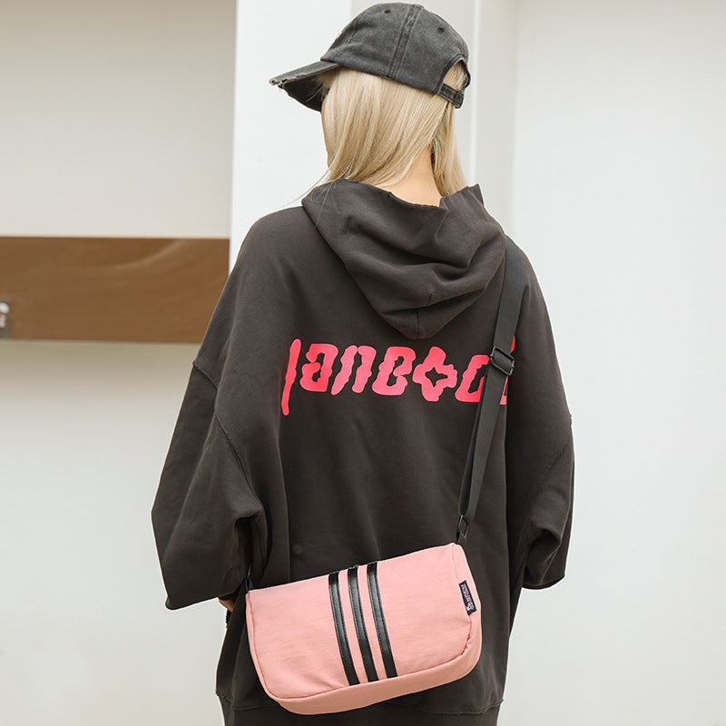 Wholesale new cross-border high-end Oxford cloth shoulder bag fashion trendy brand three-bar women's armpit bag messenger bag