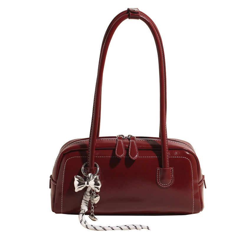 Women's bag niche portable bowling 2025 spring and summer fashion versatile shoulder bag underarm pillow bag