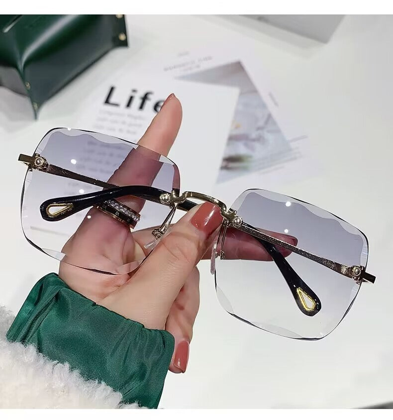 2023 new frameless trimmed sunglasses trendy women's sunscreen sunglasses show face small driving sunshade glasses