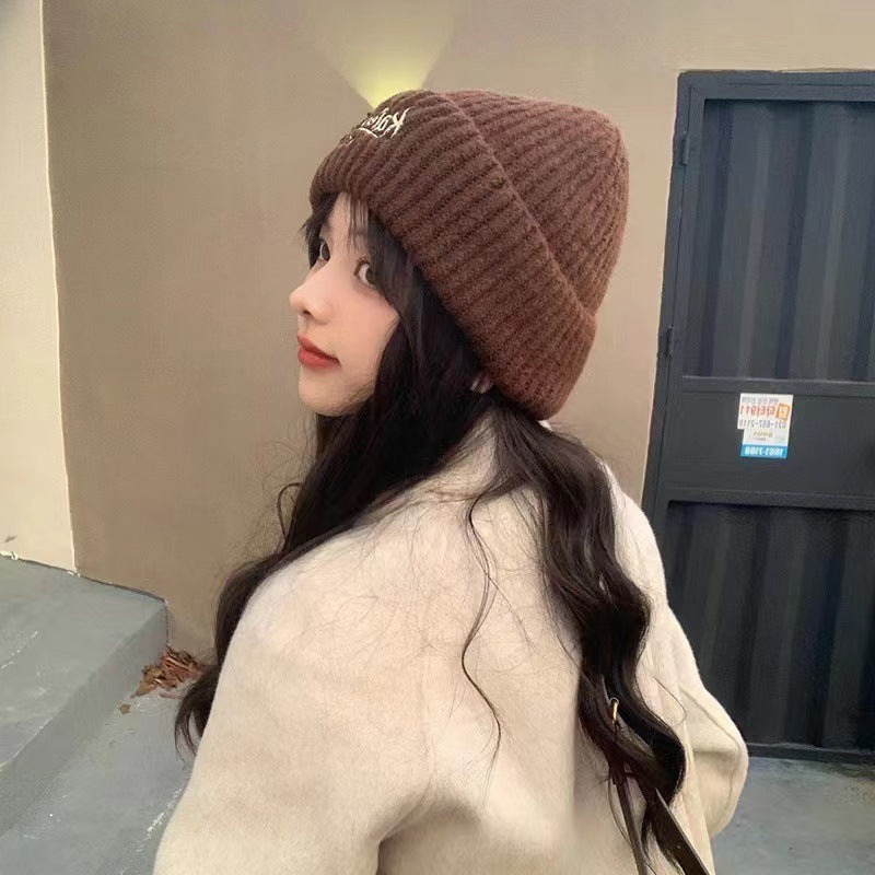 Wool hat women's autumn and winter simple knitting wide edge soft waxy surround feeling high value ear protection student style versatile