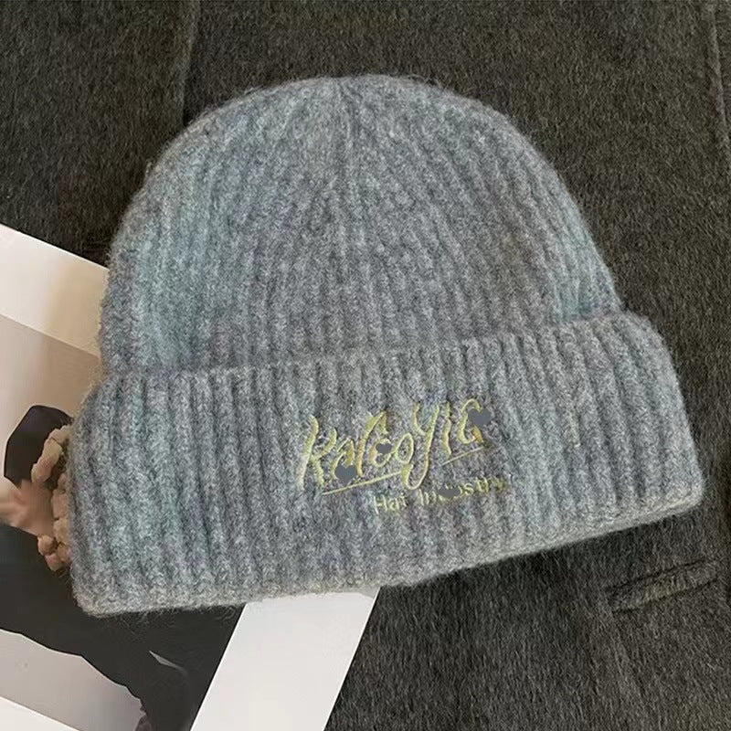 Wool hat women's autumn and winter simple knitting wide edge soft waxy surround feeling high value ear protection student style versatile
