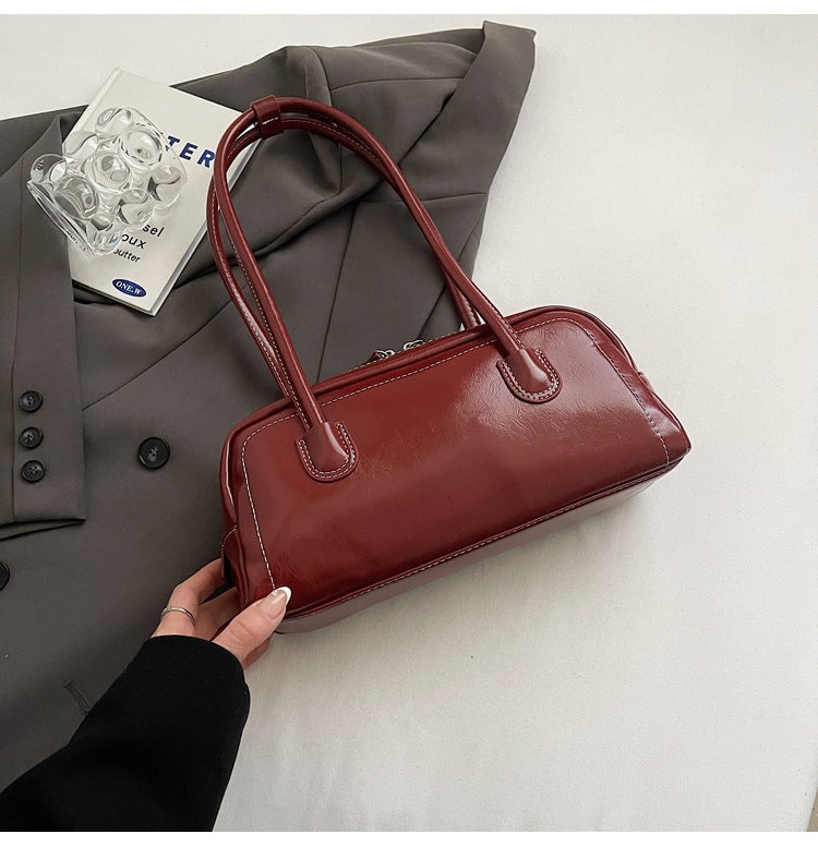 Women's bag niche portable bowling 2025 spring and summer fashion versatile shoulder bag underarm pillow bag