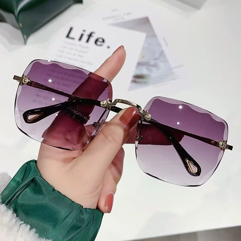 2023 new frameless trimmed sunglasses trendy women's sunscreen sunglasses show face small driving sunshade glasses