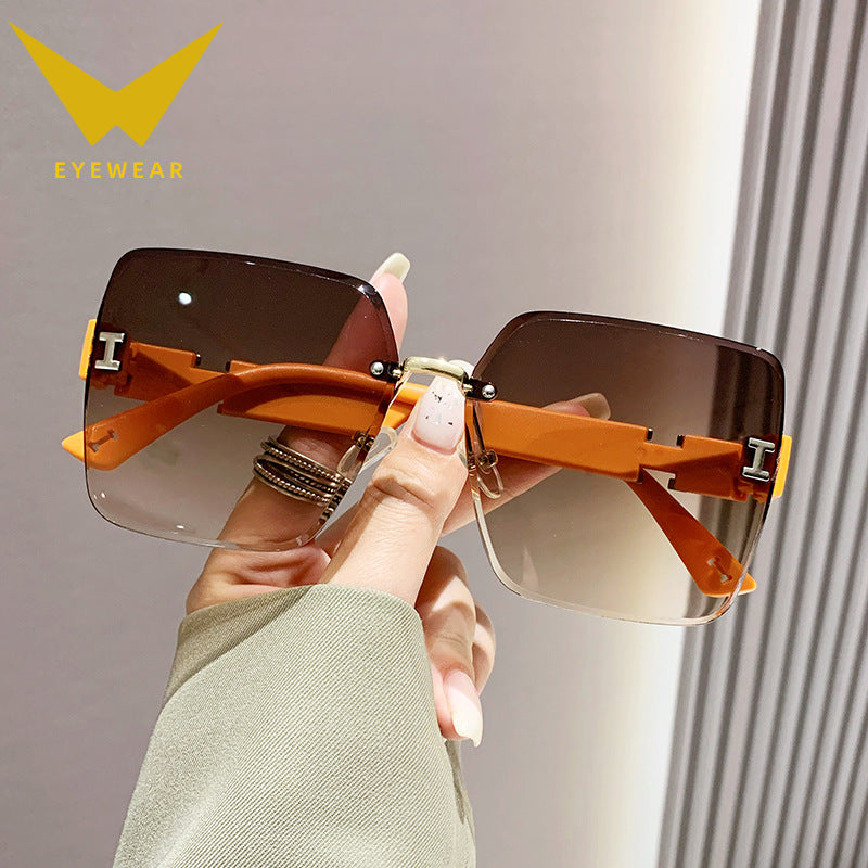 2023 new frameless two-color gradual change high-end women's trend driving sunglasses fashion sunglasses wholesale factory