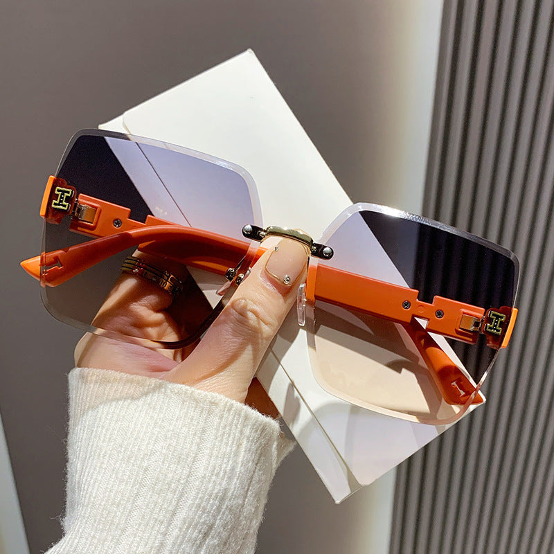 2023 new frameless two-color gradual change high-end women's trend driving sunglasses fashion sunglasses wholesale factory