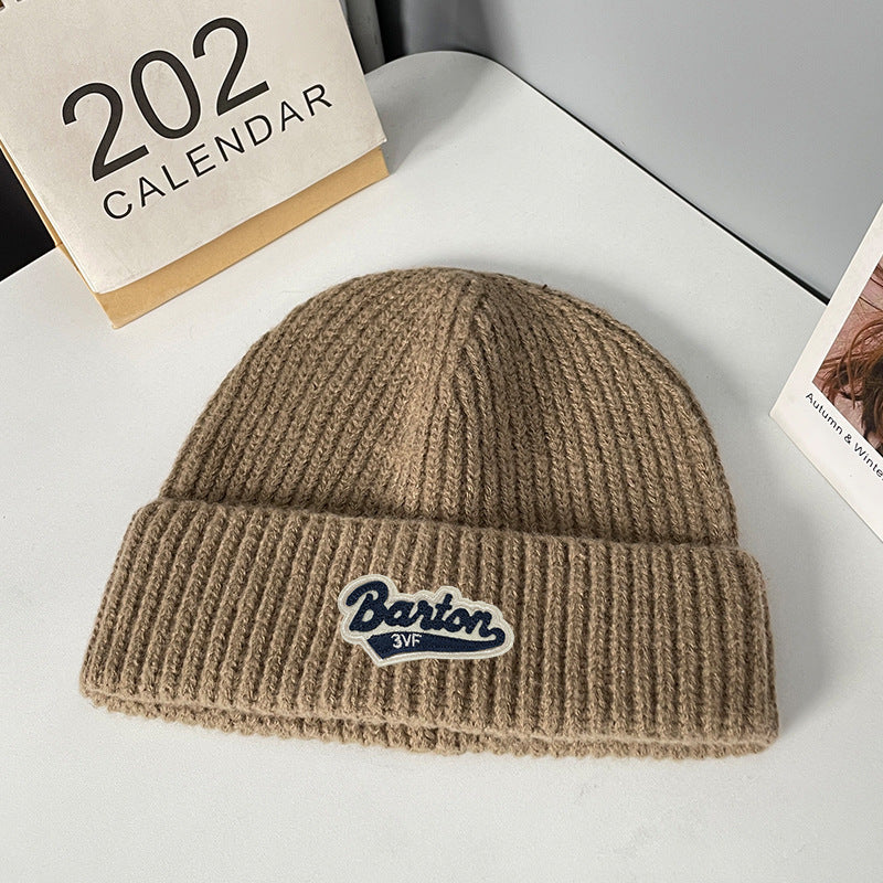 Winter letter labeling wool hat women's autumn and winter versatile warm Japanese knitted hat showing small face and ear protection cold hat man