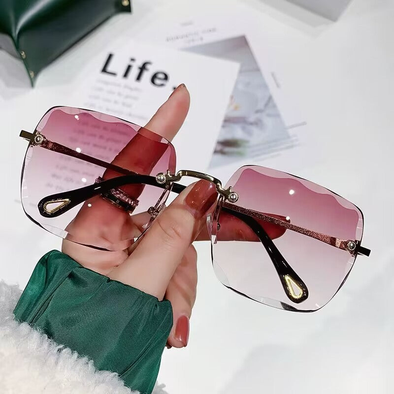 2023 new frameless trimmed sunglasses trendy women's sunscreen sunglasses show face small driving sunshade glasses
