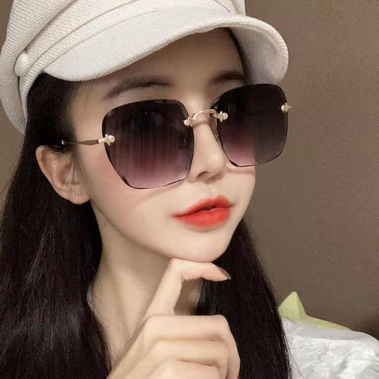 2023 new frameless trimmed sunglasses trendy women's sunscreen sunglasses show face small driving sunshade glasses