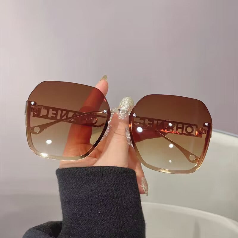 Women's fashion frameless trimmed sunglasses metal letter hollow temple trend European and American atmosphere show face small sunglasses