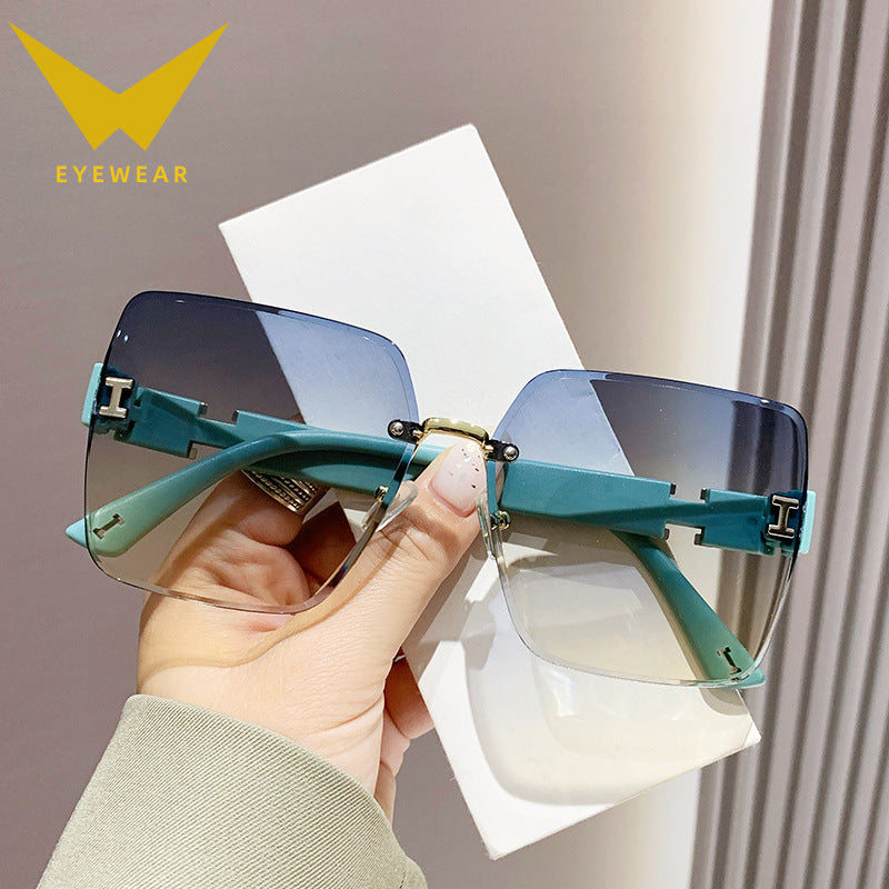 2023 new frameless two-color gradual change high-end women's trend driving sunglasses fashion sunglasses wholesale factory