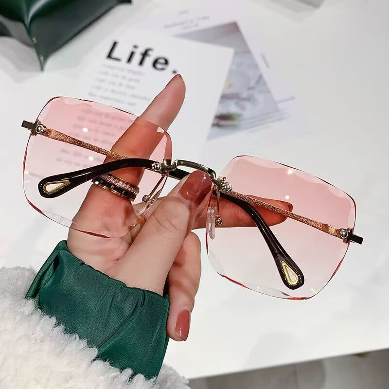 2023 new frameless trimmed sunglasses trendy women's sunscreen sunglasses show face small driving sunshade glasses