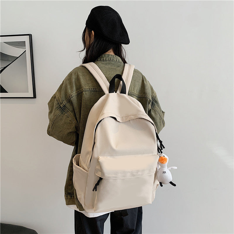 College student schoolbag simple solid color computer backpack couple versatile backpack men's large capacity backpack cross-border wholesale