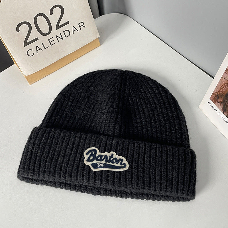 Winter letter labeling wool hat women's autumn and winter versatile warm Japanese knitted hat showing small face and ear protection cold hat man
