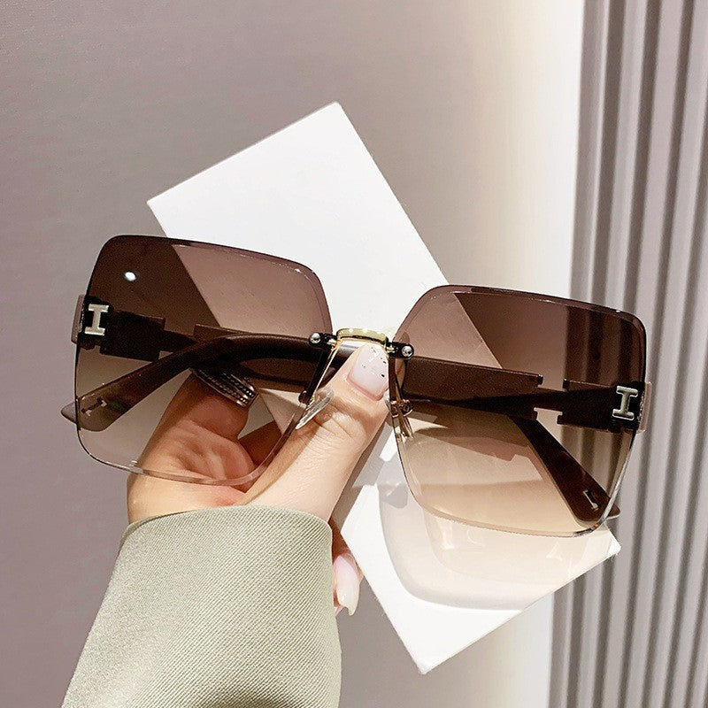 2023 new frameless two-color gradual change high-end women's trend driving sunglasses fashion sunglasses wholesale factory