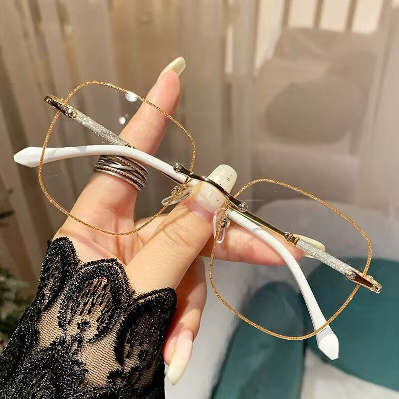2023 fashion trendy frameless gold powder design high sense anti-blue glasses women's Internet celebrity flat glasses wholesale
