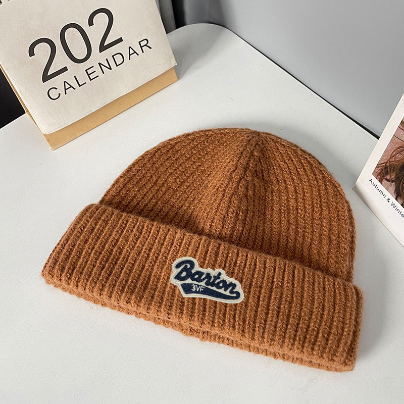 Winter letter labeling wool hat women's autumn and winter versatile warm Japanese knitted hat showing small face and ear protection cold hat man