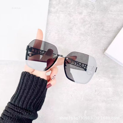 Women's fashion frameless trimmed sunglasses metal letter hollow temple trend European and American atmosphere show face small sunglasses