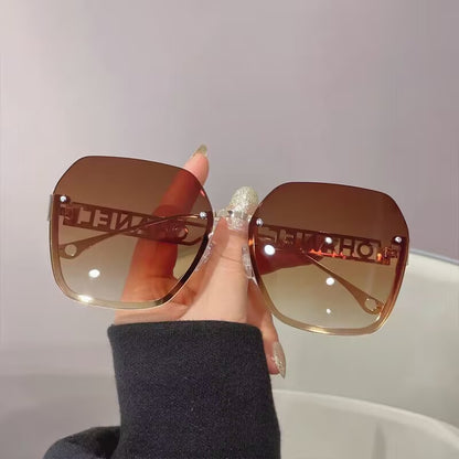 Women's fashion frameless trimmed sunglasses metal letter hollow temple trend European and American atmosphere show face small sunglasses
