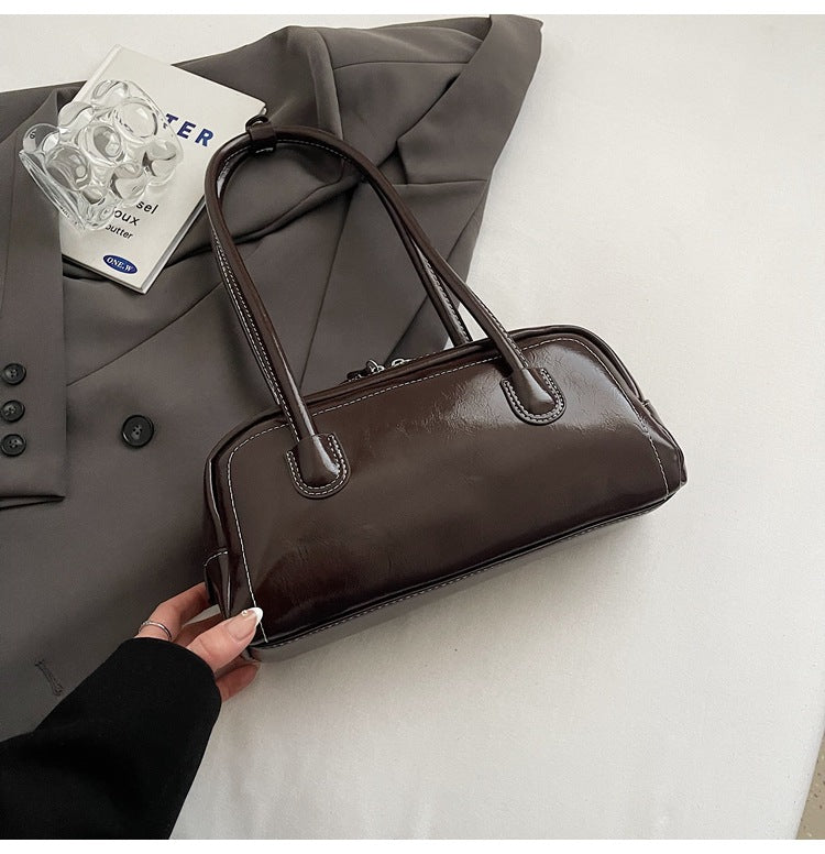 Women's bag niche portable bowling 2025 spring and summer fashion versatile shoulder bag underarm pillow bag