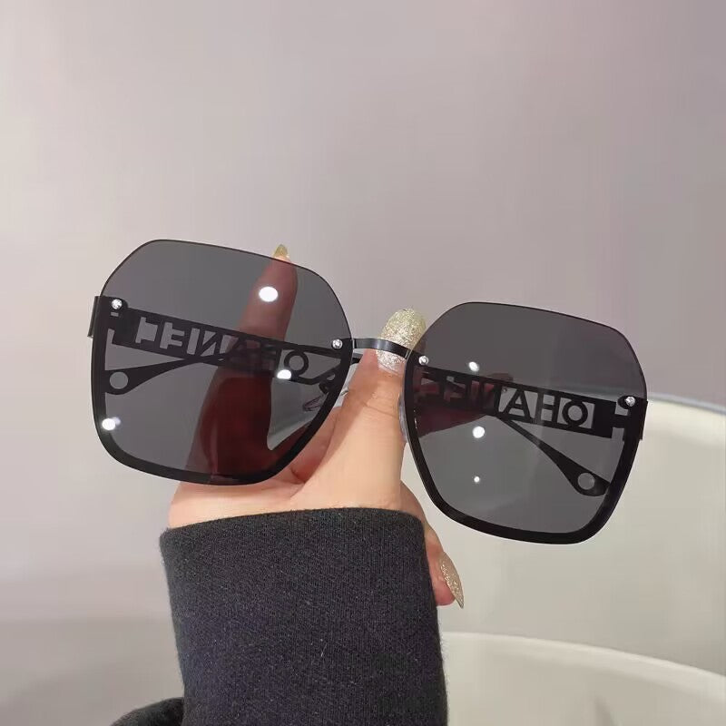 Women's fashion frameless trimmed sunglasses metal letter hollow temple trend European and American atmosphere show face small sunglasses