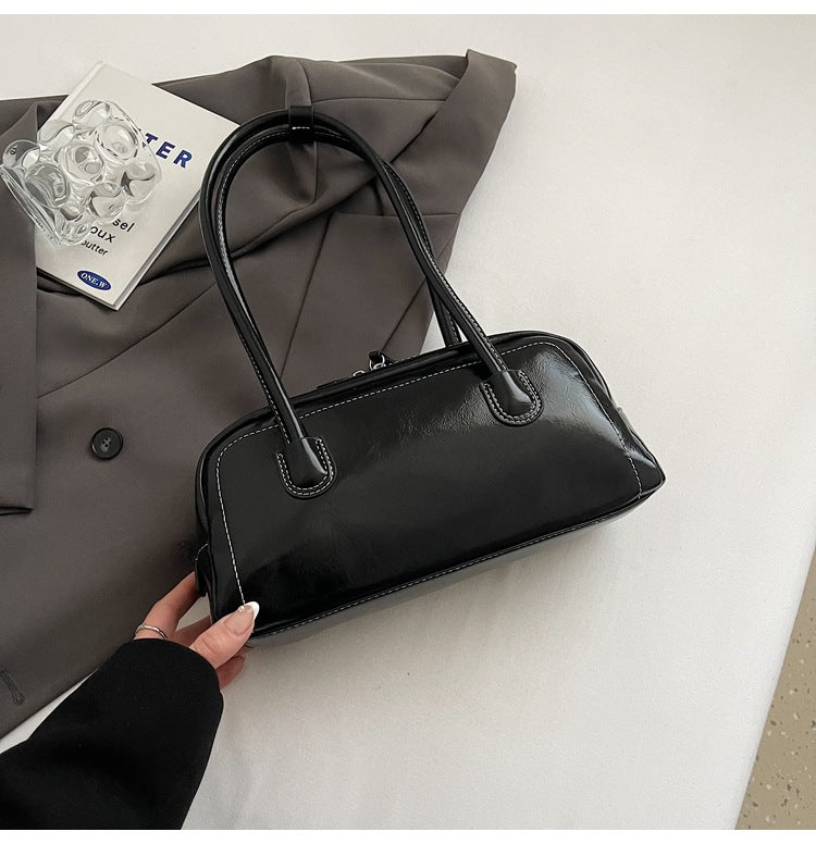 Women's bag niche portable bowling 2025 spring and summer fashion versatile shoulder bag underarm pillow bag