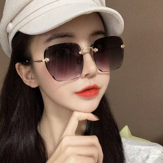 2023 new frameless trimmed sunglasses trendy women's sunscreen sunglasses show face small driving sunshade glasses