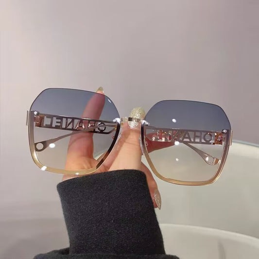 Women's fashion frameless trimmed sunglasses metal letter hollow temple trend European and American atmosphere show face small sunglasses
