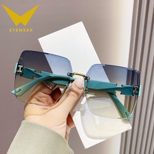 2023 new frameless two-color gradual change high-end women's trend driving sunglasses fashion sunglasses wholesale factory