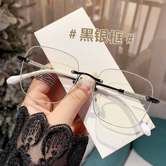 2023 fashion trendy frameless gold powder design high sense anti-blue glasses women's Internet celebrity flat glasses wholesale