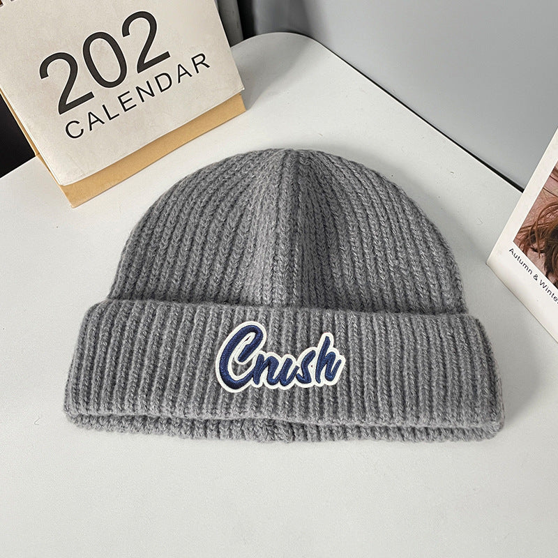 Winter letter labeling wool hat women's autumn and winter versatile warm Japanese knitted hat showing small face and ear protection cold hat man